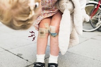Girl with bandades on her knee